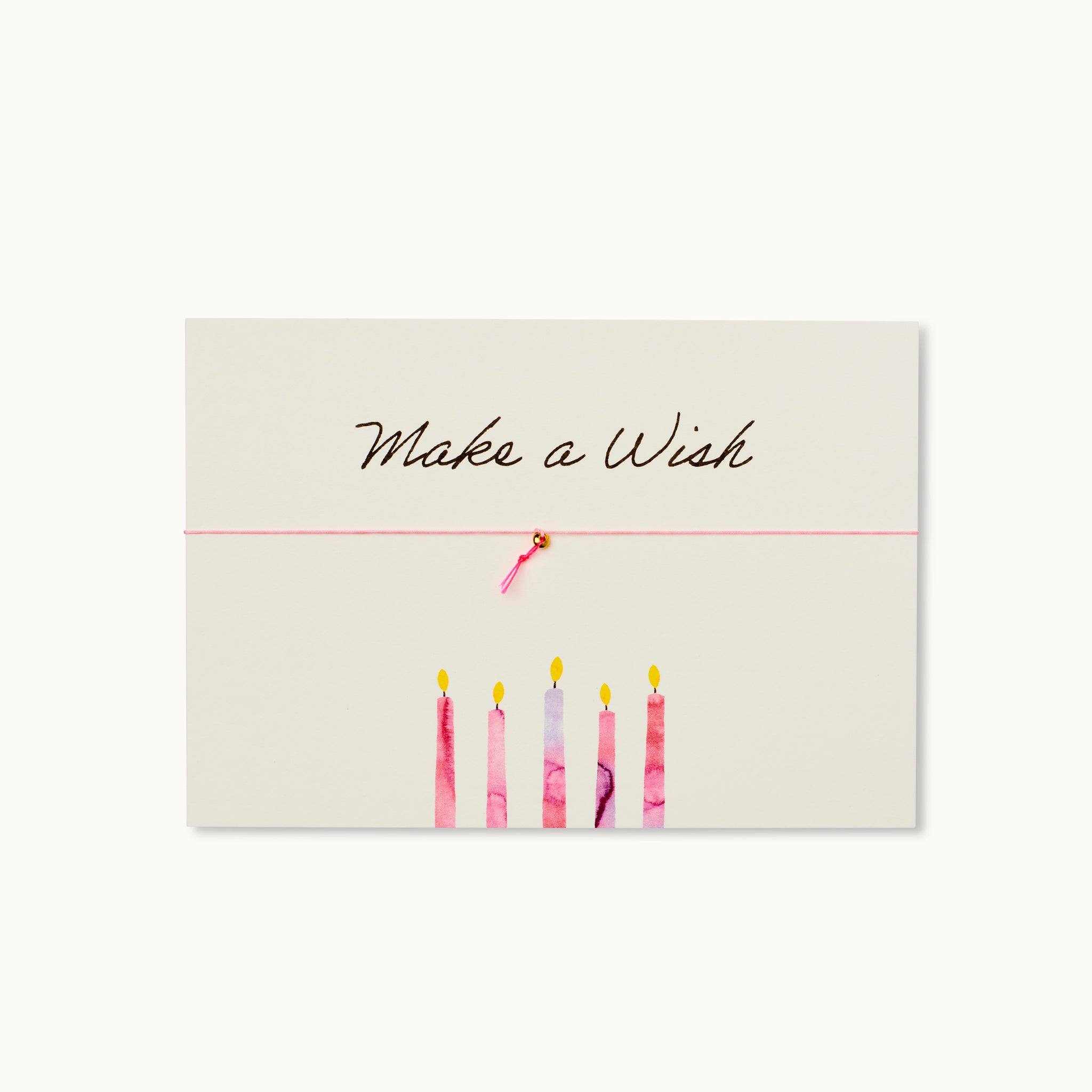 Make a Wish! Karte mit einem Ring als 18K vergoldeter Anhänger mit einem neonpinken Wunschbändchen an einem rosafarbenen Armband. 
